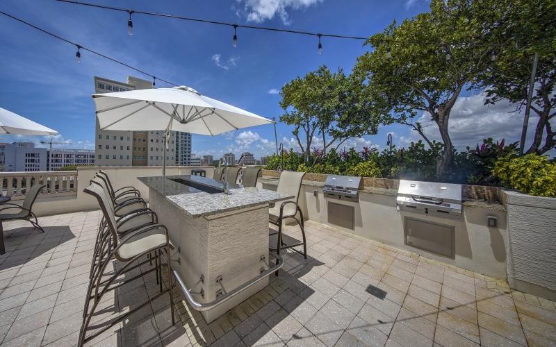 a patio with a table and chairs