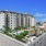 wide exterior view showing building, local community and some views of outdoor pool and courtyard