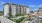 wide exterior view showing building, local community and some views of outdoor pool and courtyard