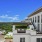 wide exterior view showing building, local community and some views of outdoor pool and courtyard