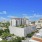 wide exterior view showing building, local community and some views of outdoor pool and courtyard