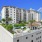 wide exterior view showing building, local community and some views of outdoor pool and courtyard
