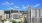 wide exterior view showing building, local community and some views of outdoor pool and courtyard