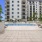 pool area with reclining seats and landscaping