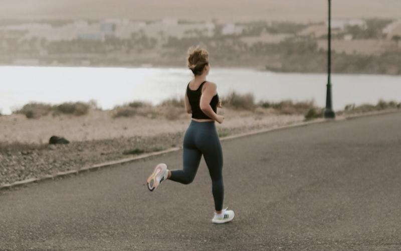 a woman running on a road