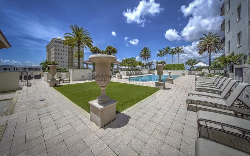 a pool with chairs around it