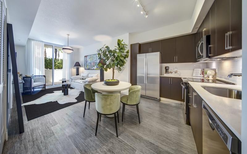 a kitchen with a table and chairs