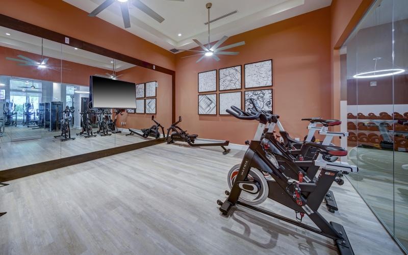 a bike shop with a tv and bicycles