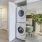 a room with white cabinets and a washing machine